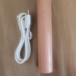 Pink UV light with White Charging Cable